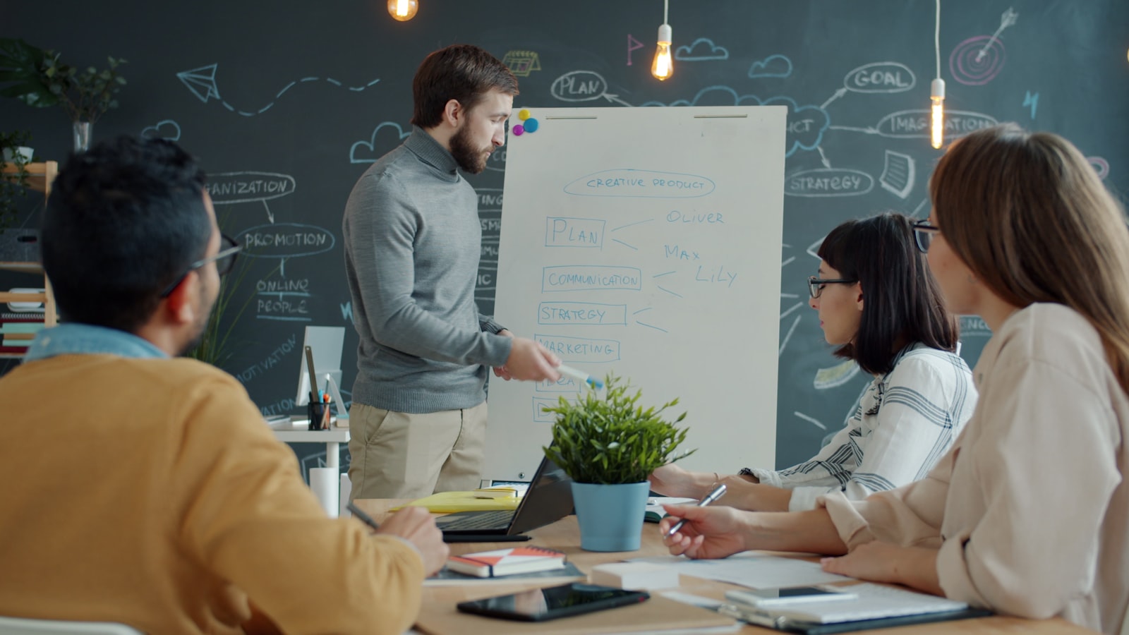 A HealthFoundry team mapping a client's data governance model on a whiteboard